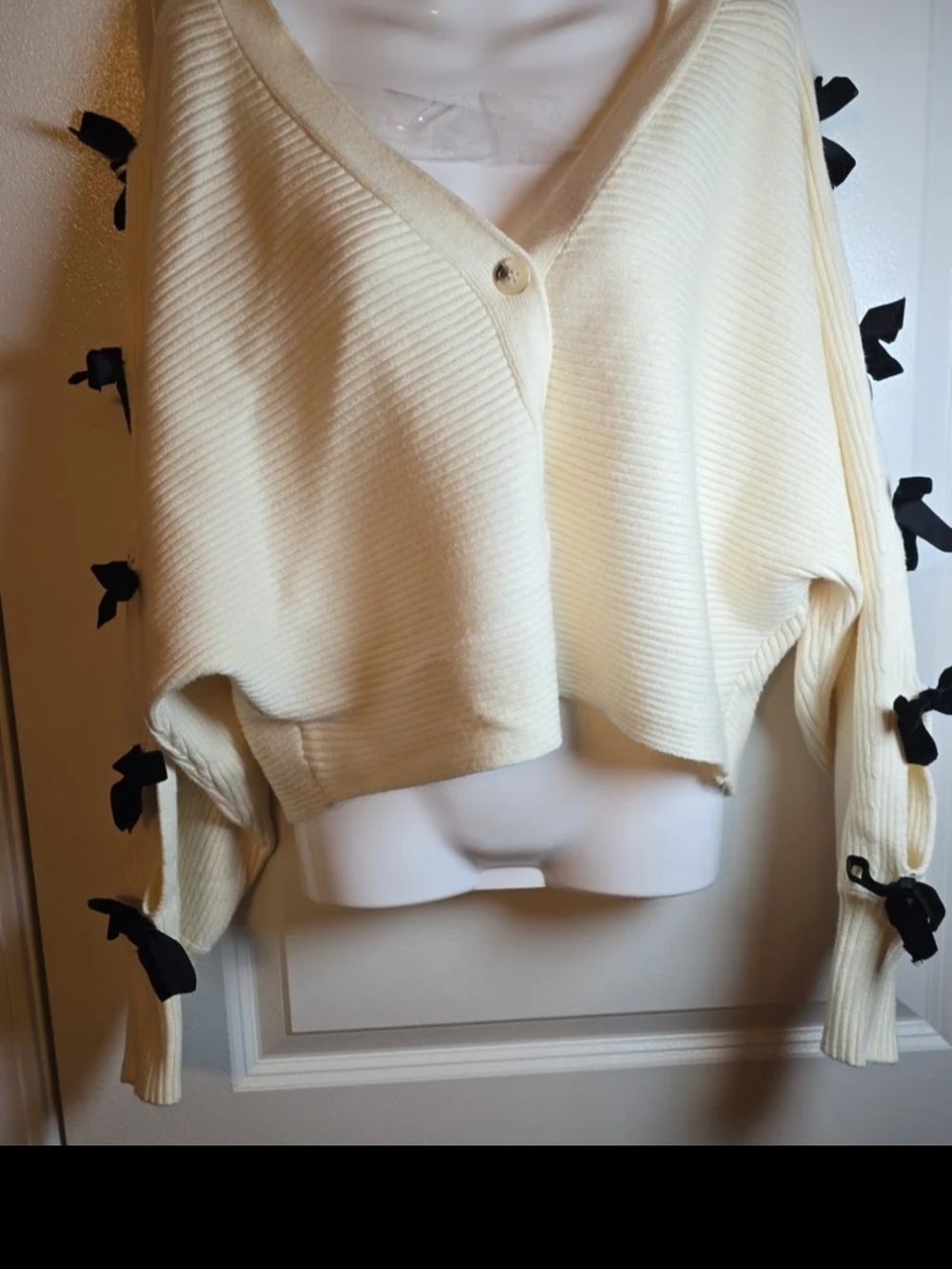 Cream V-Neck Ribbed Button Front Sweater with Black Bow Detail
